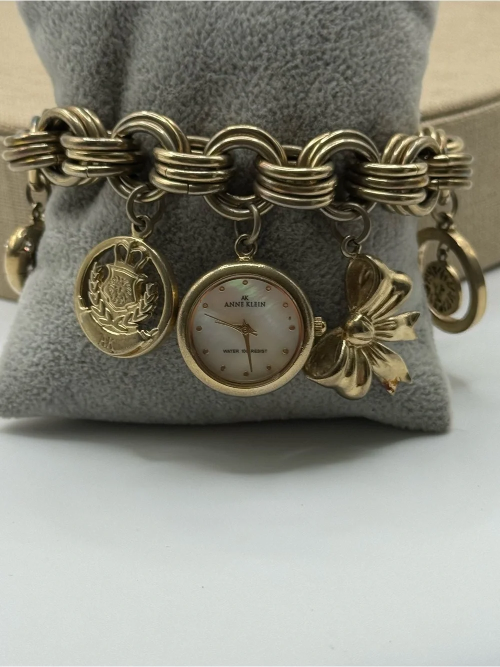 Anne Klein Gold Charm Bracelet Watch with Mother-of-Pearl Dial & Bow Charm